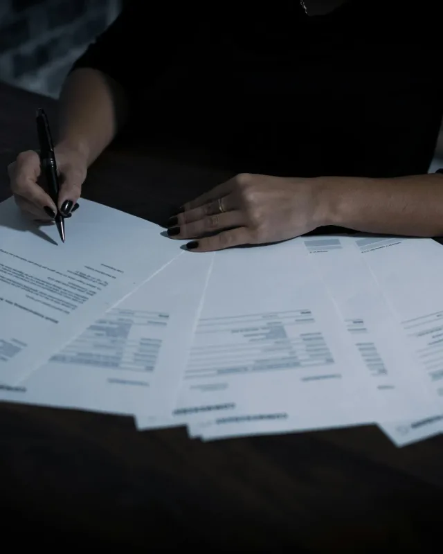 Editor reviewing a manuscript at a desk